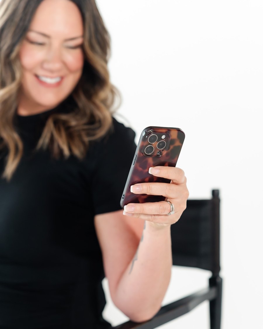 Fallon Collins smiling at her phone